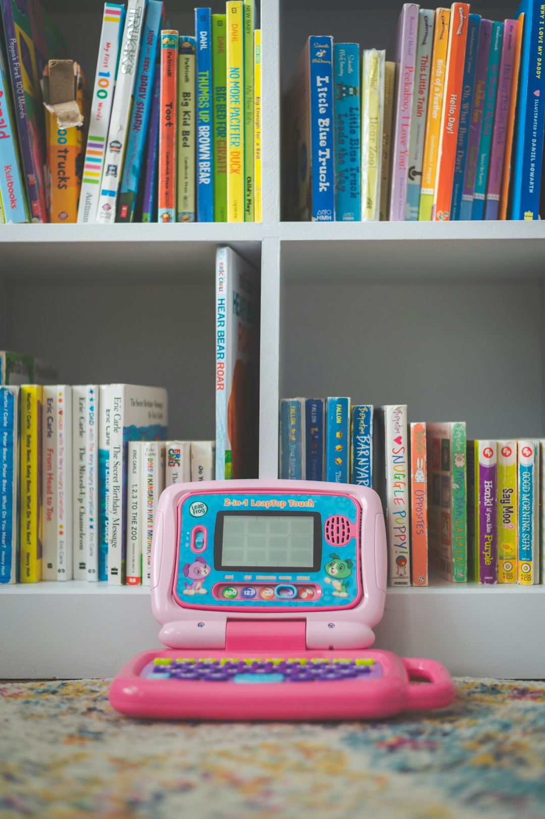 pink-and-white-digital-device-on-white-wooden-shelf-87jw-hlqrhc